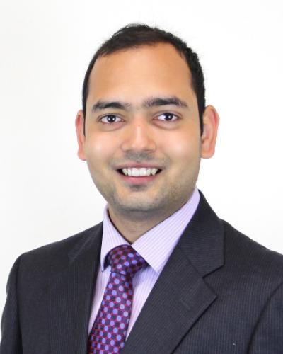 Madhur Srivastava smiling with white background